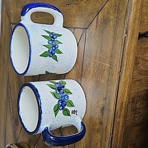 Maine Blueberry pottery mugs both signed.
